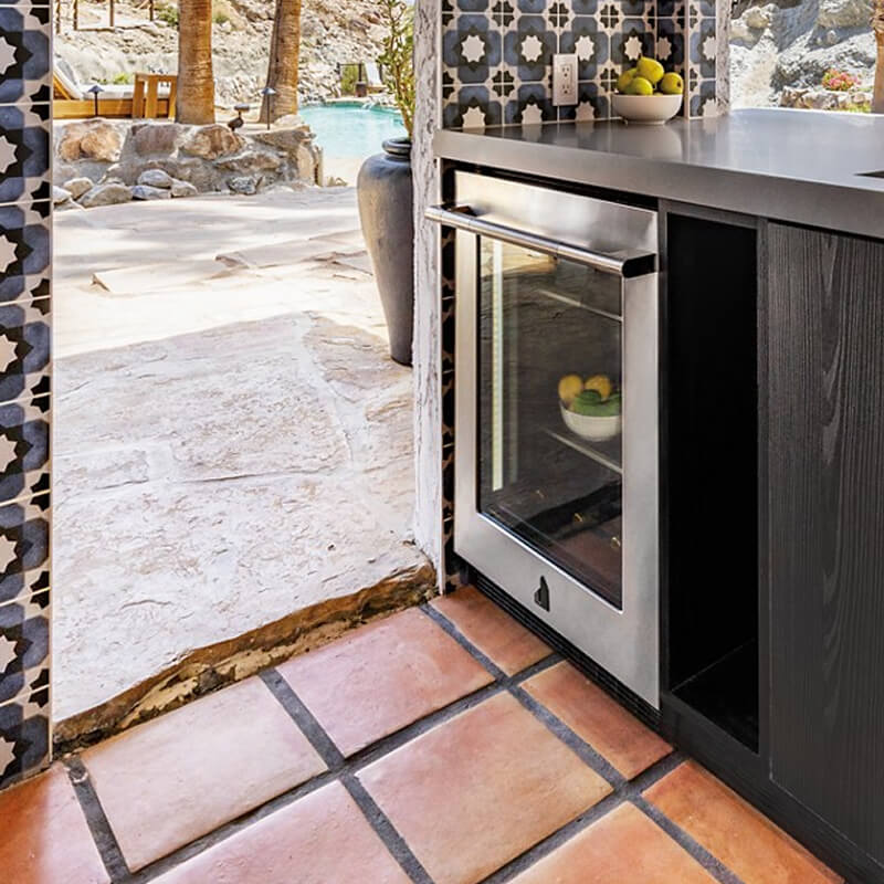 An indoor to outdoor entertainment home bar.