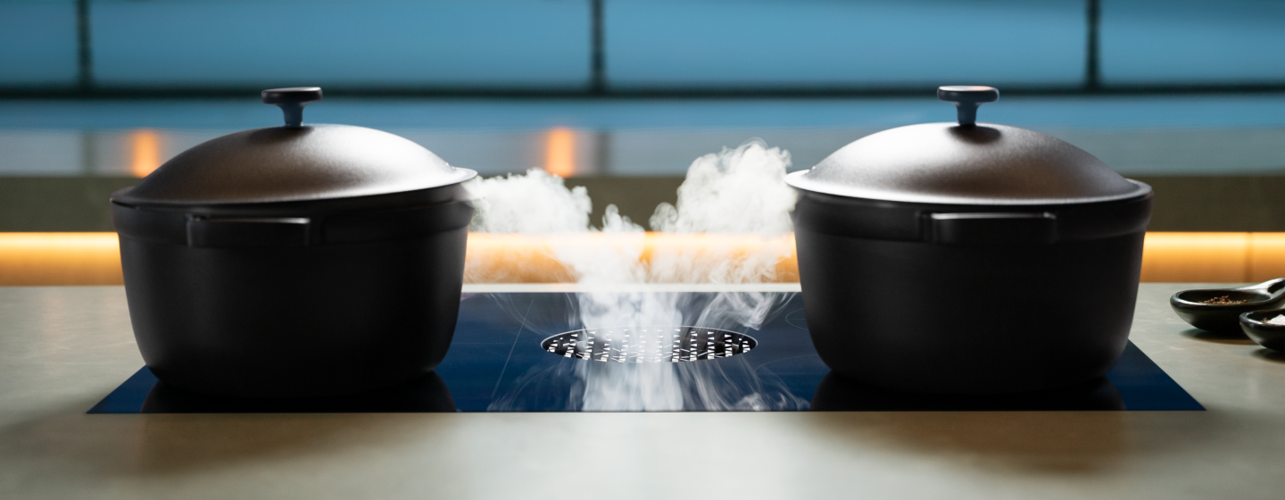 Induction-compatible cookware on a luxury induction cooktop.
