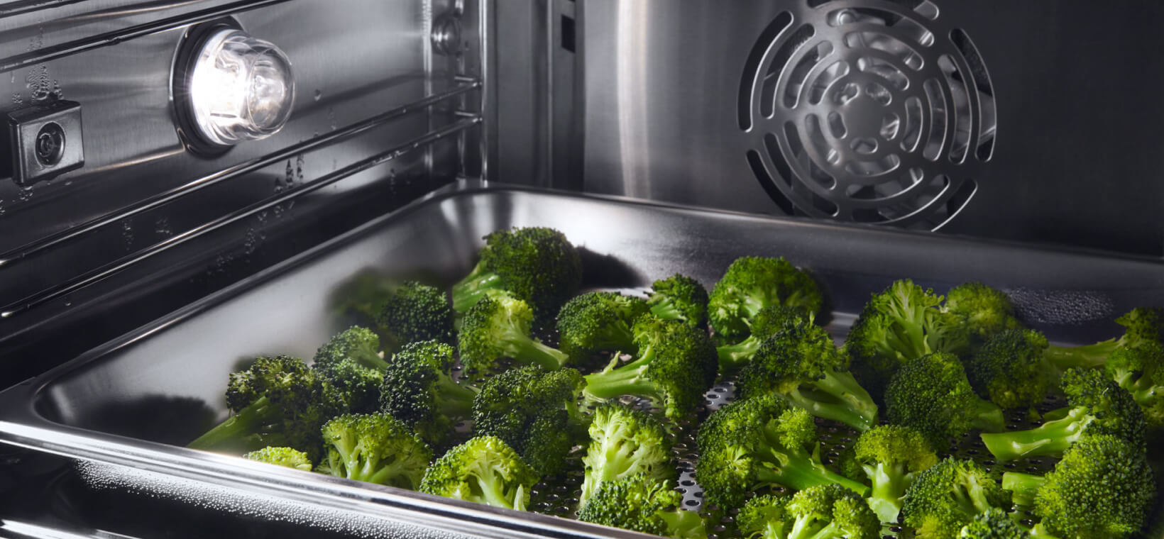 Broccoli cooking in a convection oven