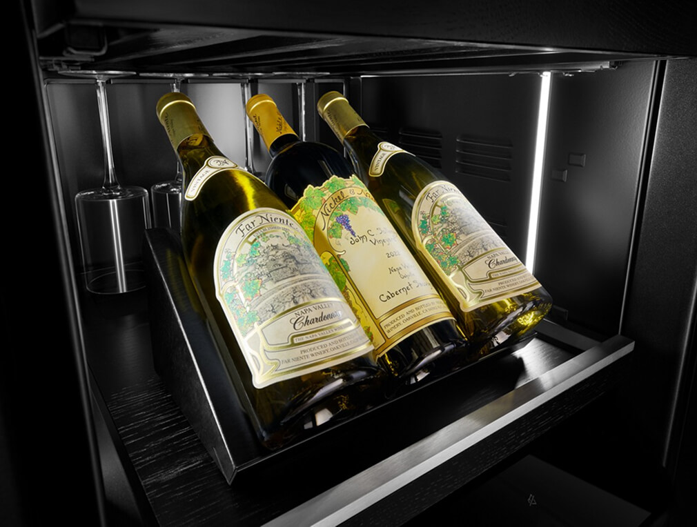Interior of a JennAir® Wine Column with illuminated bottles and Obsidian finish