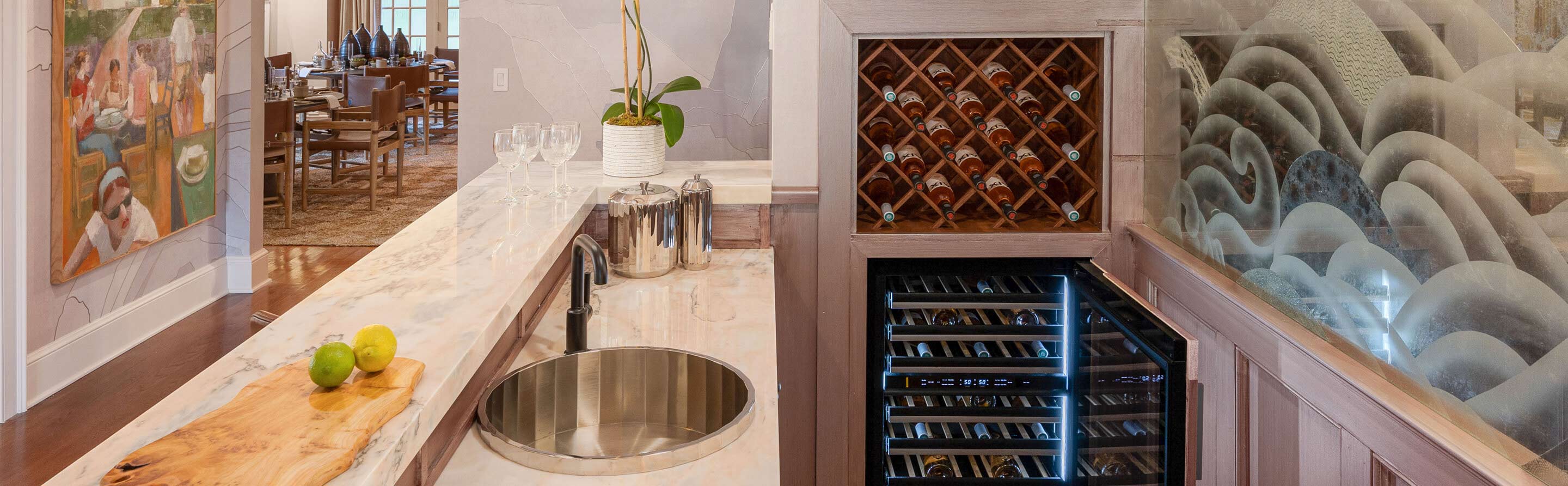 An elegant built-in bar with a JennAir® Wine Cellar.