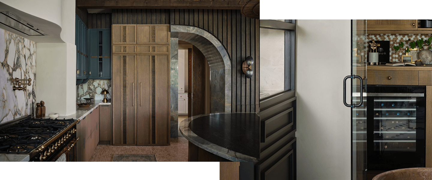 A dark kitchen with blue and brown cabinets. A JennAir® wine cellar filled with drinks.