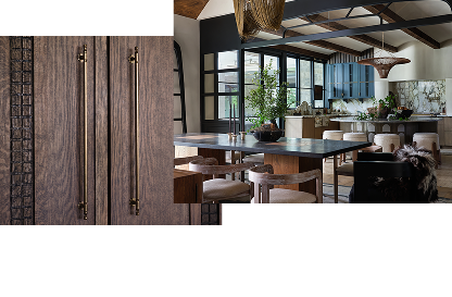A close up of the handles of the paneled refrigerator. A kitchen and dining room with blue accents and multiple seating areas.