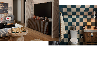 A room with a TV and a chess set next to a bench. A checkered bathroom with a brown bathroom cabinet.