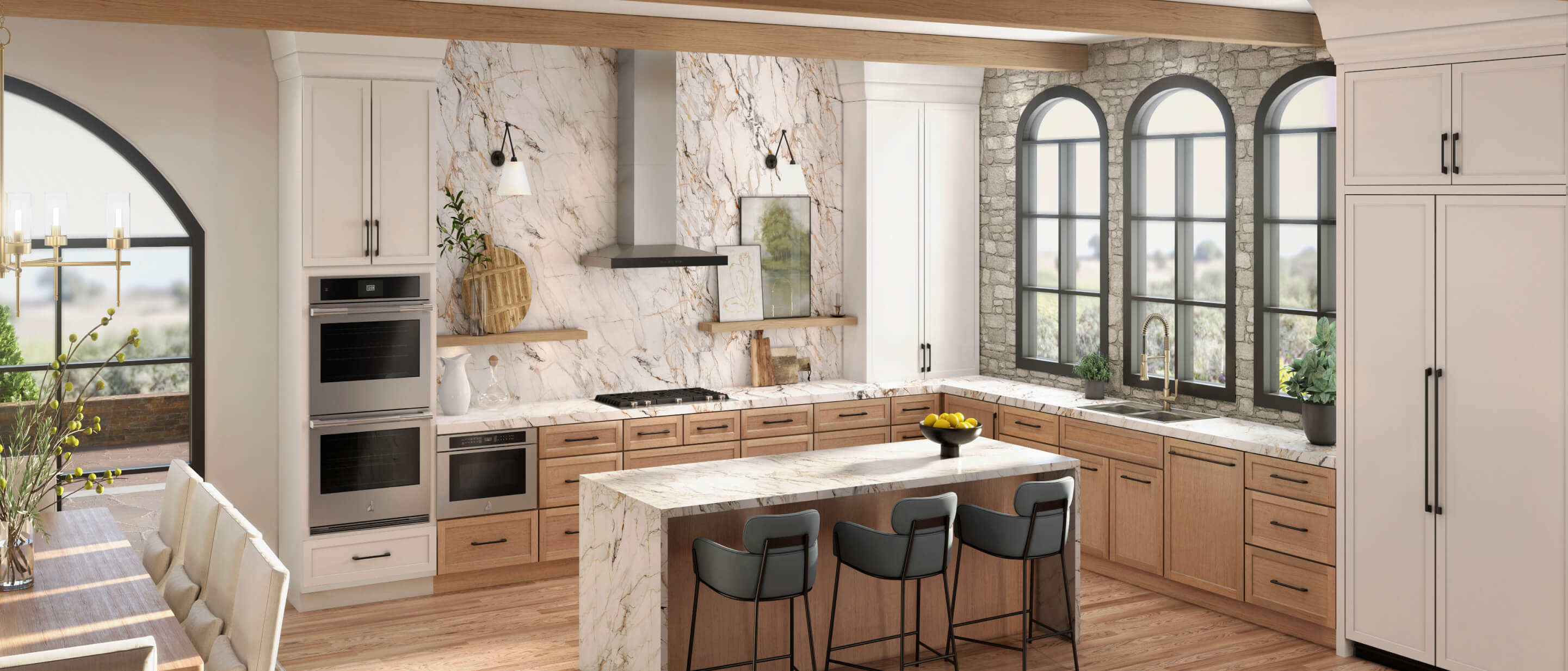 A contemporary luxury kitchen in white marble and light wood featuring a suite of JennAir® appliances.