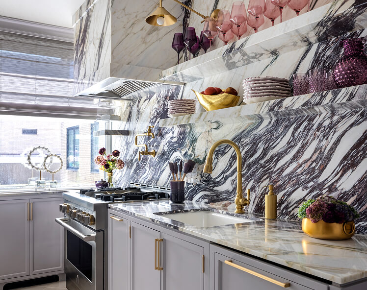 A marble kitchen with JennAir® appliances, designed by Corey Damen Jenkins.
