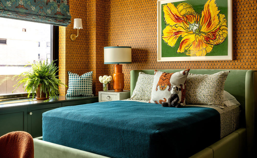 An orange and blue bedroom designed by Corey Damen Jenkins.