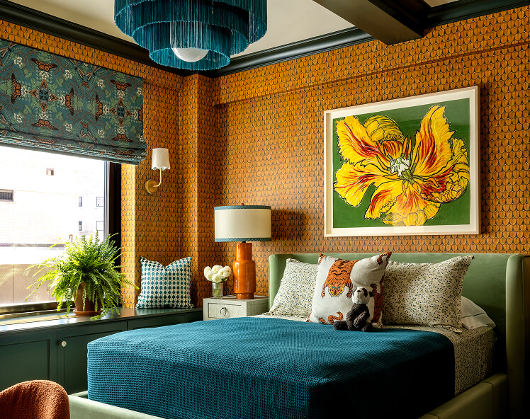 An orange and blue bedroom designed by Corey Damen Jenkins.