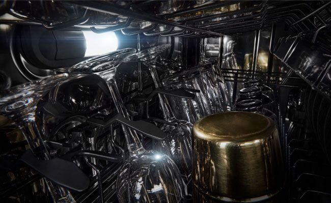 Wine glasses and other glassware in a JennAir Dishwasher. 