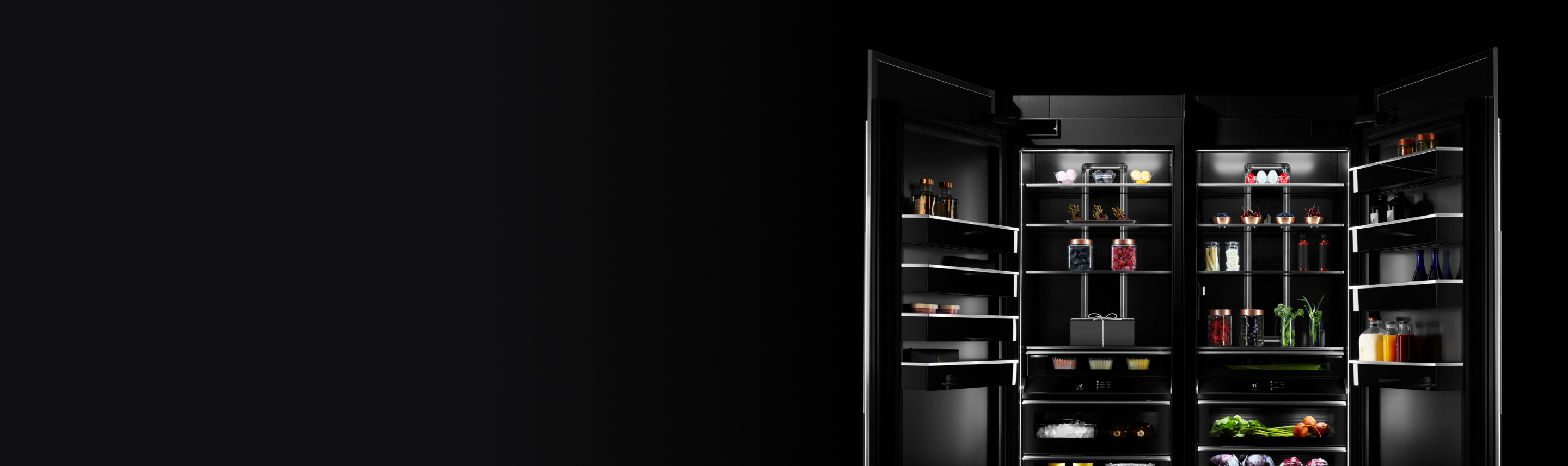Two open JennAir columns stocked with luxurious ingredients and fine foods.