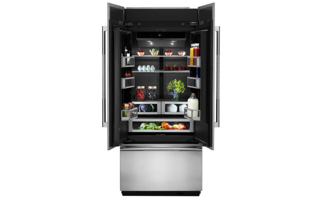 A fully stocked JennAir built-in refrigerator.