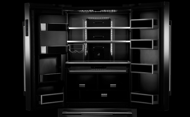An open JennAir refrigerator. Showing the Daring Obsidian Interior. 