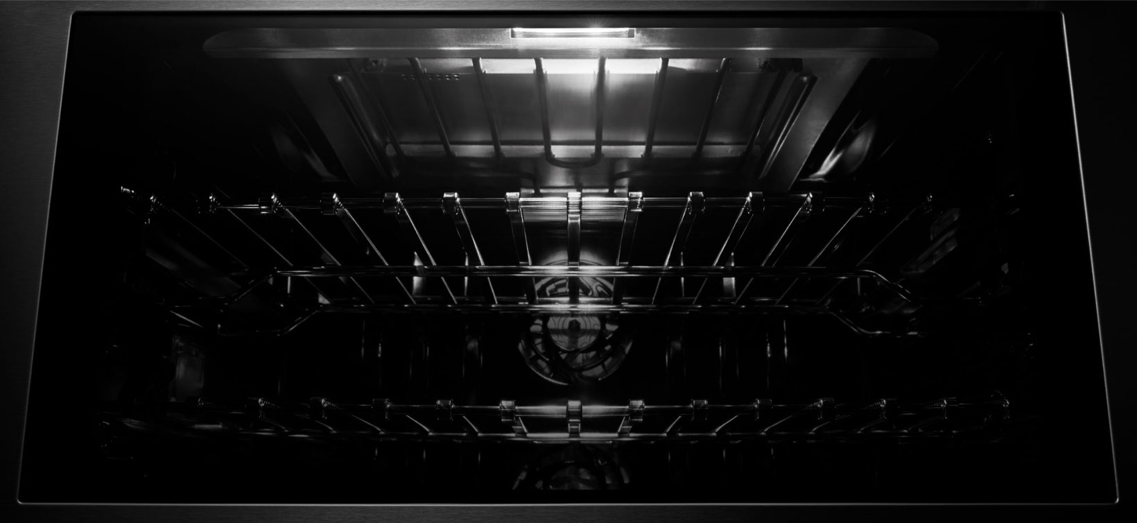 The Daring Obsidian Interior of a JennAir Wall Oven. 