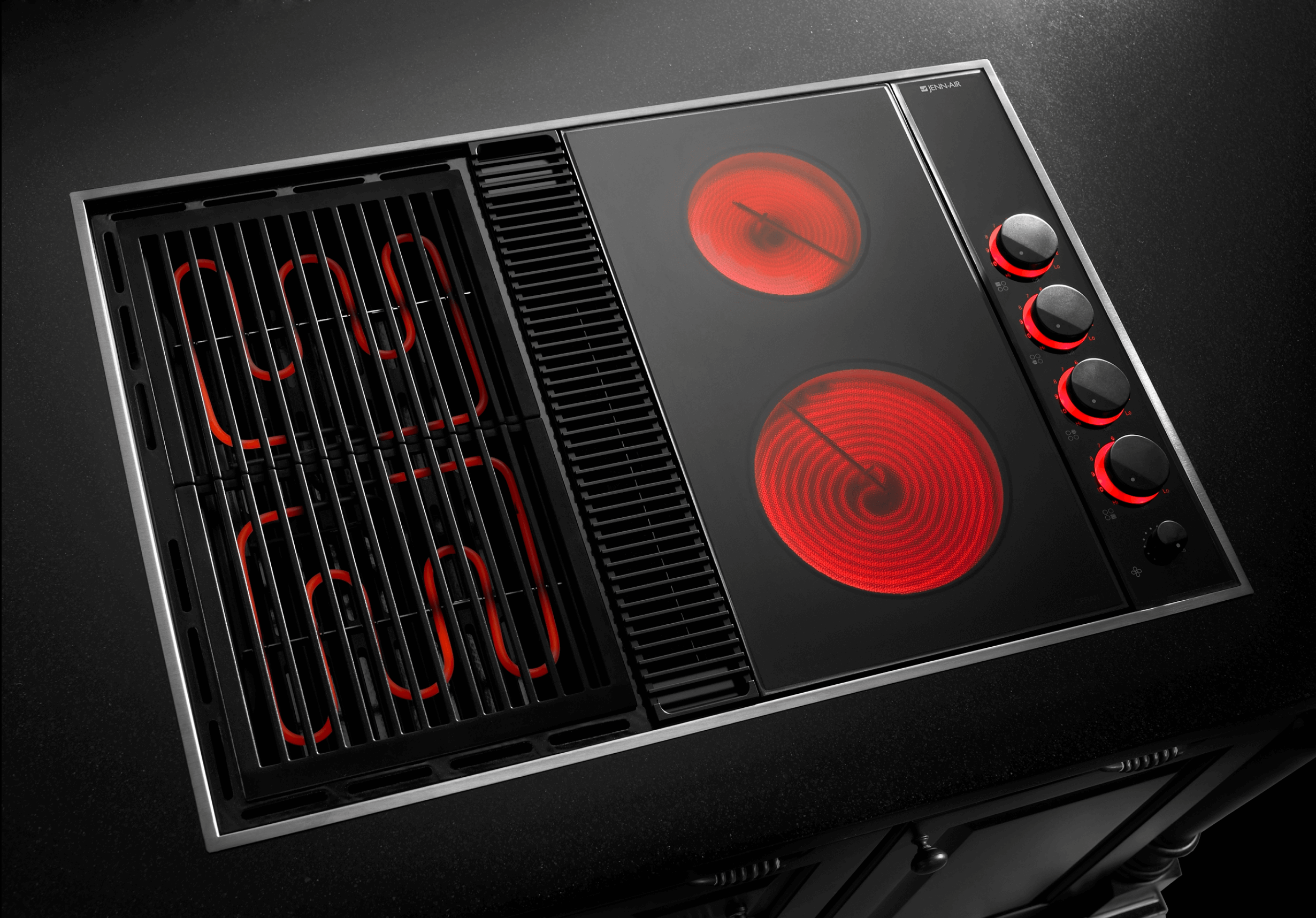 JennAir® electric cooktop with heating elements turned on