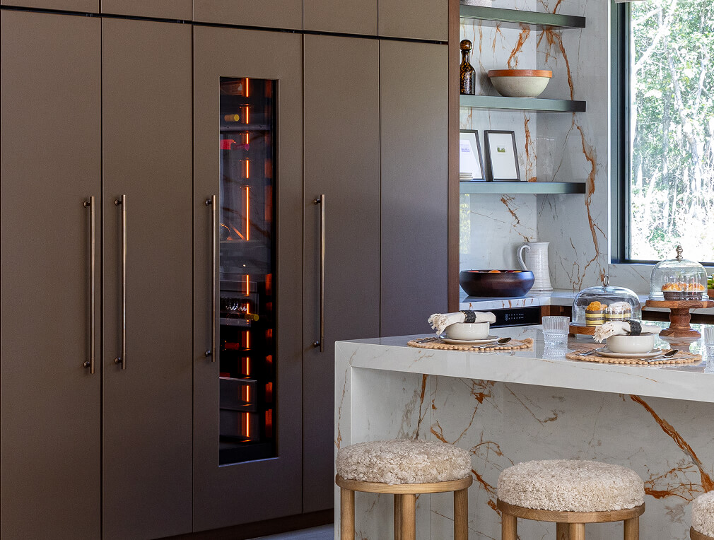 A JennAir® Wine Column Refrigerator filled with bottles of wine