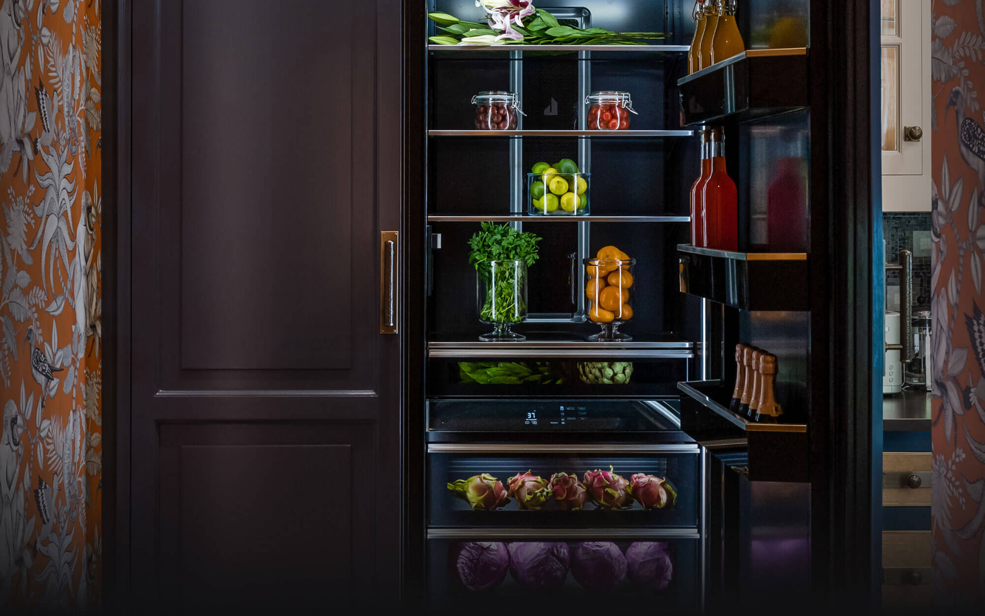 A JennAir® Column pair with custom panels in a real kitchen.