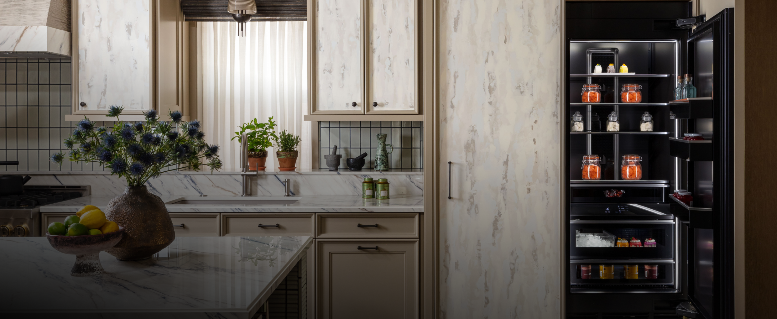 A luxury kitchen with a custom panel clad column.