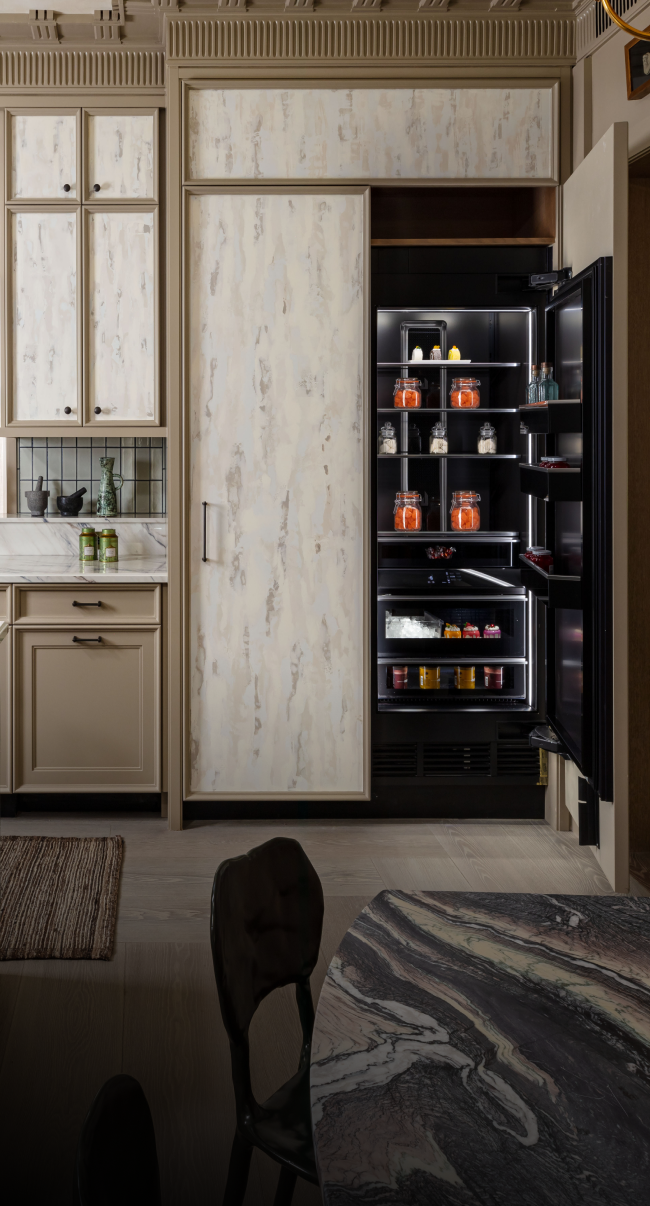 A luxury kitchen with a custom panel clad column.