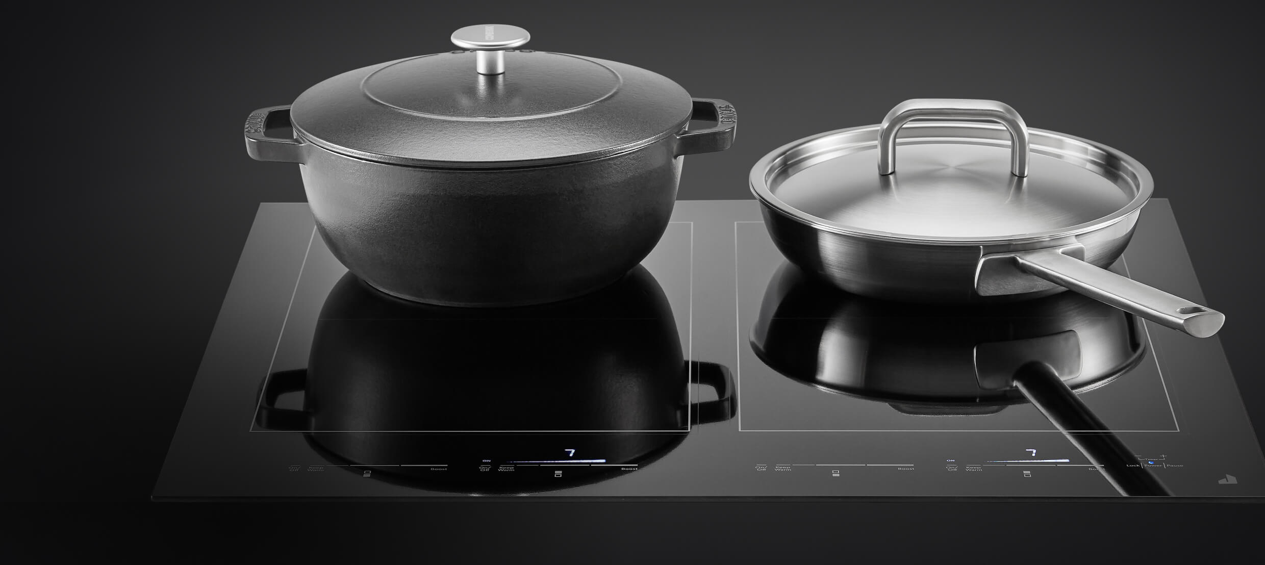 A pot and pan on an induction cooktop.