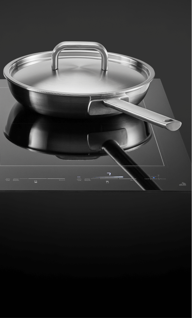 A pot and pan on an induction cooktop.