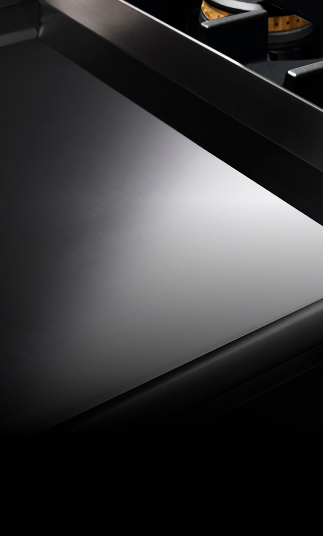 A Chrome-Infused Griddle on a gas rangetop.