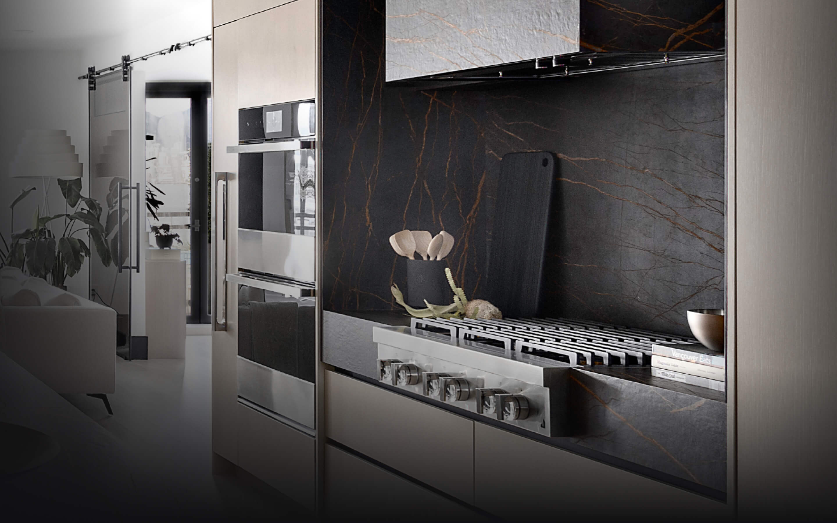 A JennAir® Gas Rangetop in a light-colored kitchen with dark accents.