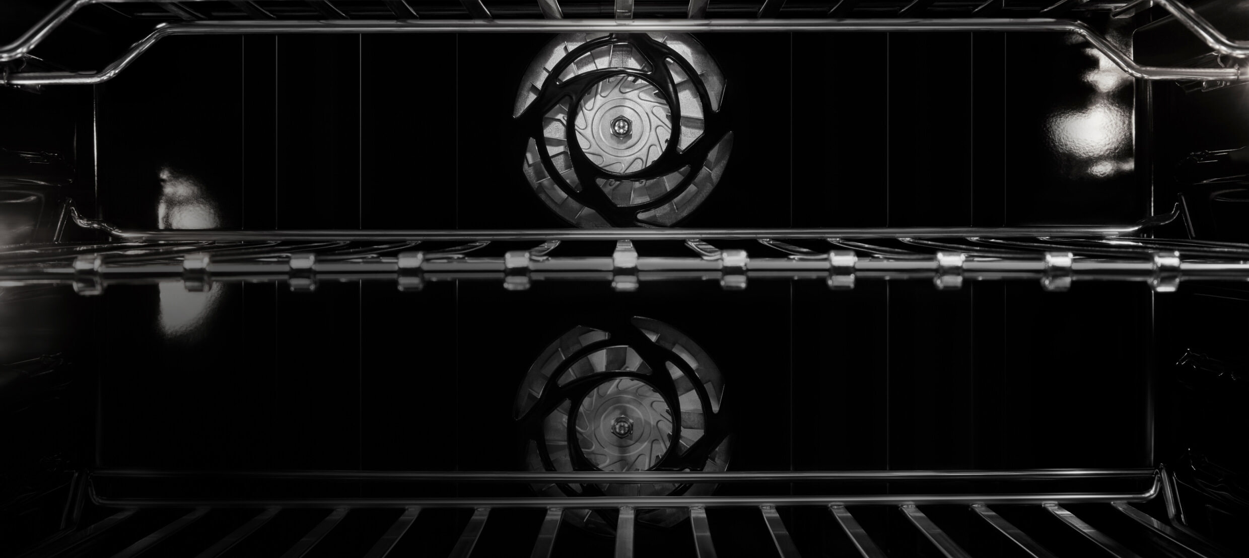 The interior of JennAir® Wall Oven, showing the twin convection fans.