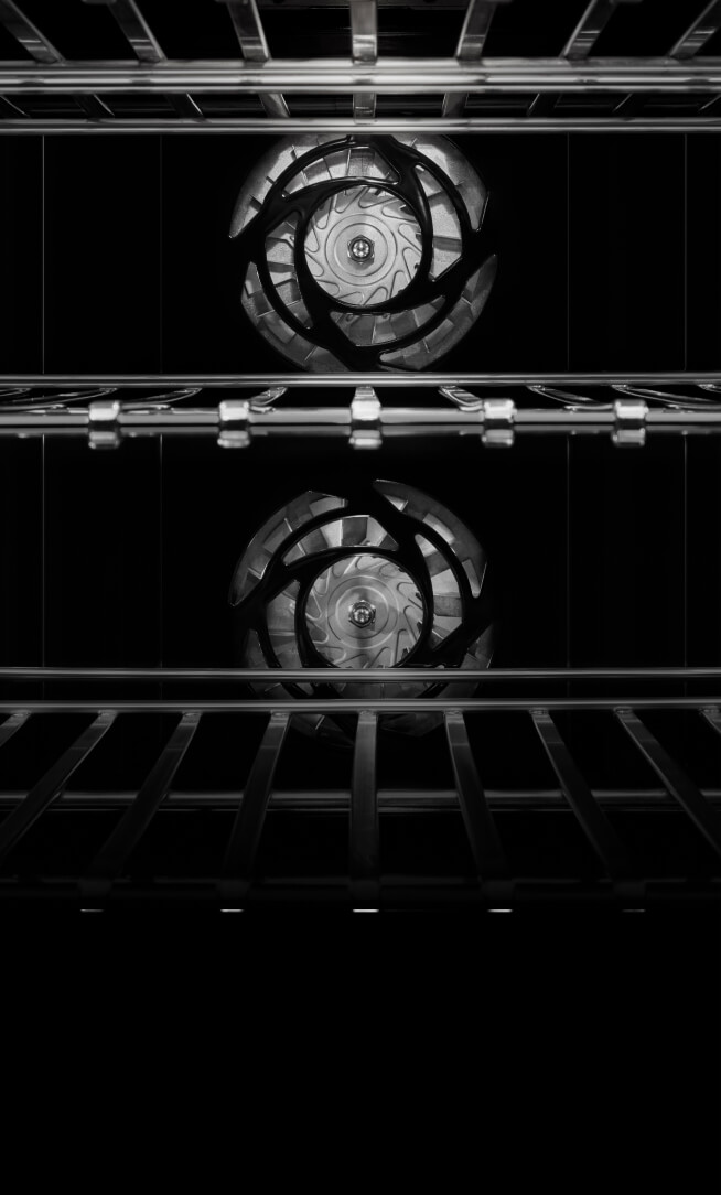 The interior of JennAir® Wall Oven, showing the twin convection fans.