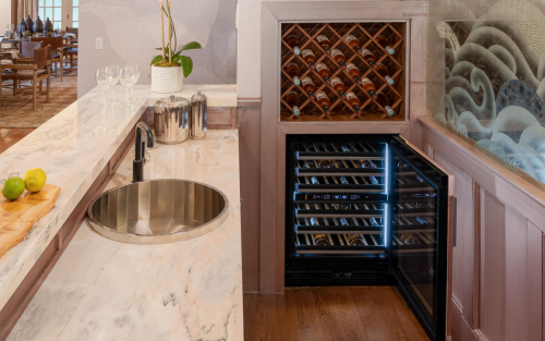An elegant built-in bar with a JennAir® Wine Cellar.