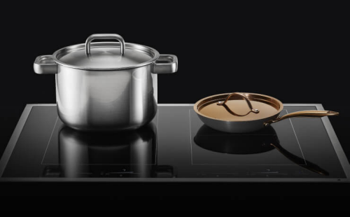 A pan and a pot on top of an induction cooktop