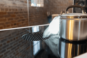 The JennAir® NextGen Downdraft Induction Cooktop in use