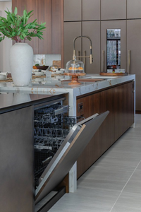 An open JennAir® dishwasher
