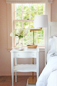 The side table next to the bed in the Purple Bedroom.