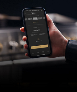 A person holding a phone with the Culinary Center displayed on it.